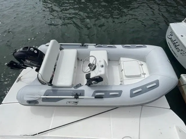 Slide: The Image of Gray inflatable boat with outboard motor on water, Tiara Yachts C53 Coupe 2017. - 48