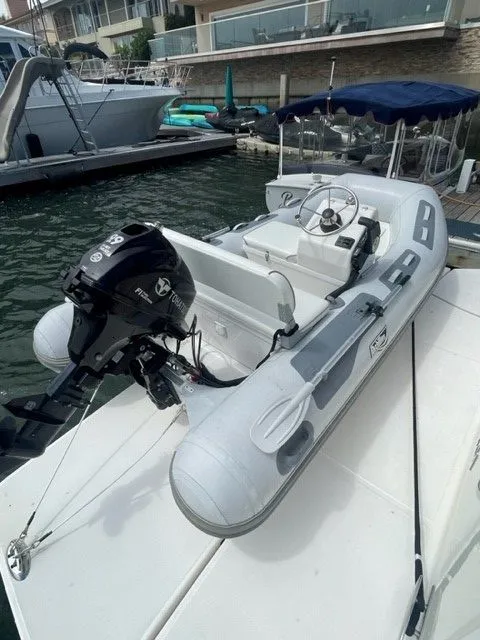 Slide: The Image of 2017 Tiara Yachts C53 Coupe with dinghy at dock. - 49