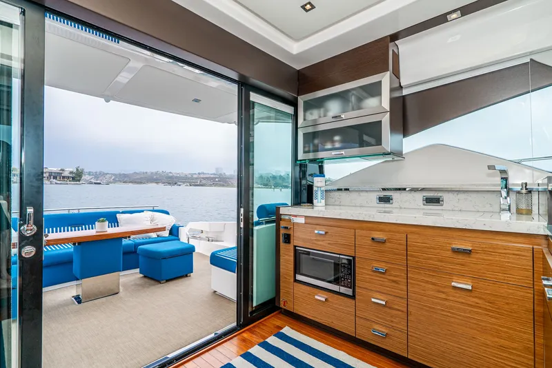 Slide: The Image of Interior of 2017 Tiara Yachts C53 Coupe with water view. - 8