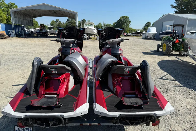 Slide: The Image of 2013 Yamaha WaveRunner FX HO jet skis parked outdoors on a sunny day. - 5