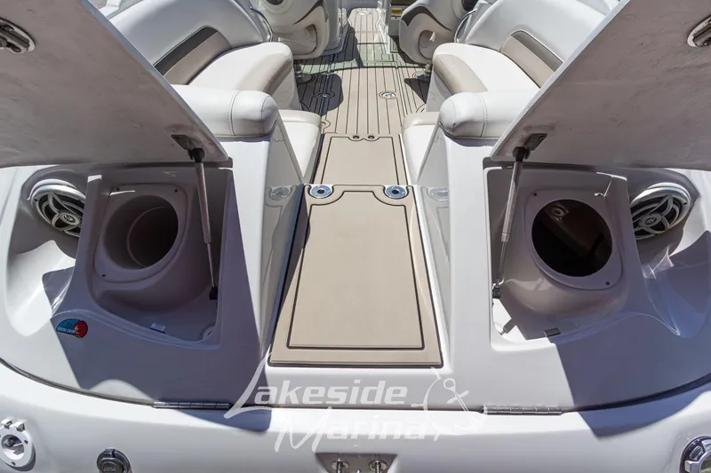 Slide: The Image of 2008 Crownline 240 LS boat interior with open storage compartments and seating. - 10