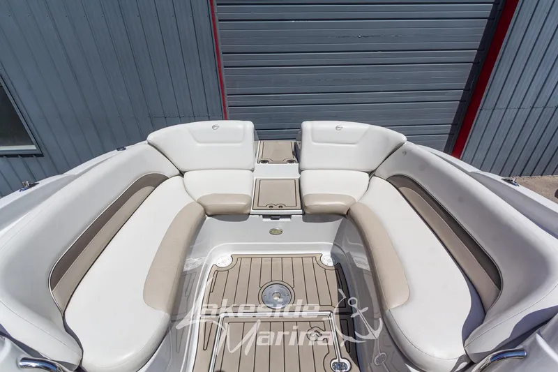 Slide: The Image of 2008 Crownline 240 LS boat interior with beige and white seating. - 13