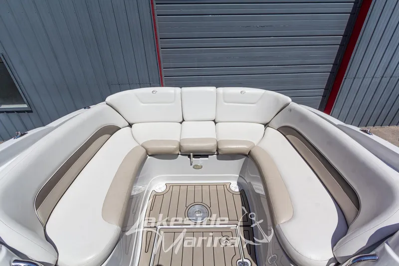 Slide: The Image of 2008 Crownline 240 LS boat interior with beige and white seating. - 14
