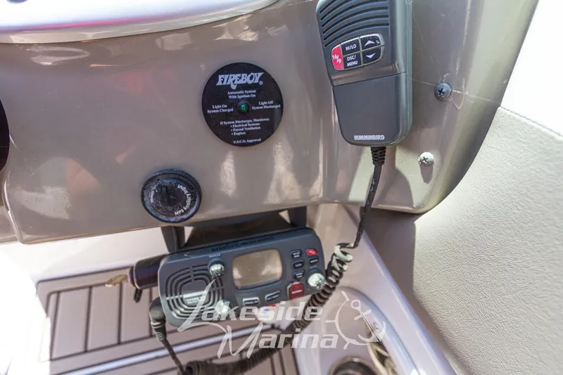 Slide: The Image of Control panel of a 2008 Crownline 240 LS boat with communication devices. - 24