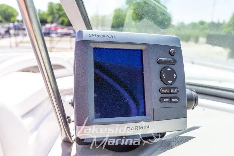 Slide: The Image of Garmin GPSmap 431s on 2008 Crownline 240 LS boat dashboard, sunny day. - 25