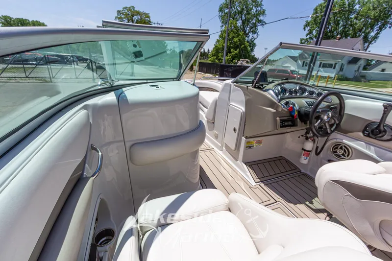 Slide: The Image of Interior view of 2008 Crownline 240 LS boat with steering wheel and seating. - 26