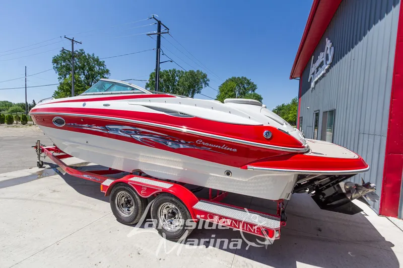 Slide: The Image of 2008 Crownline 240 LS boat on trailer outside marina building. - 3