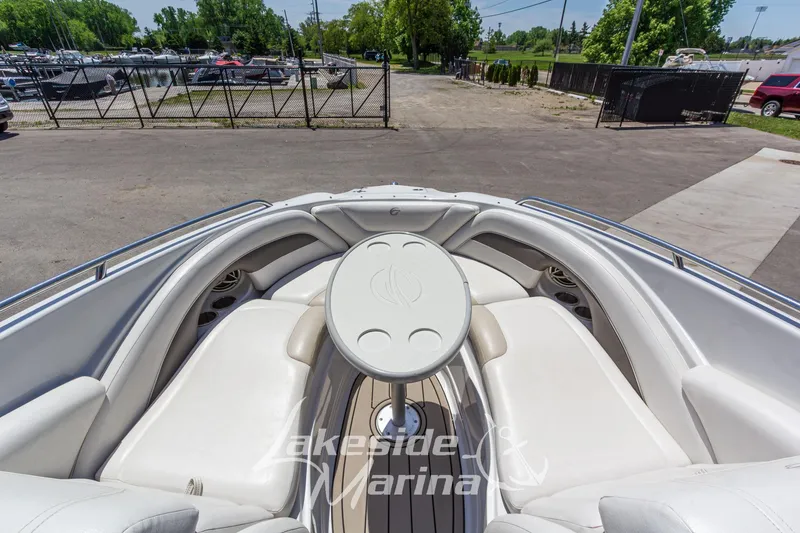 Slide: The Image of 2008 Crownline 240 LS boat interior with white seating and table at Lakeside Marina. - 32