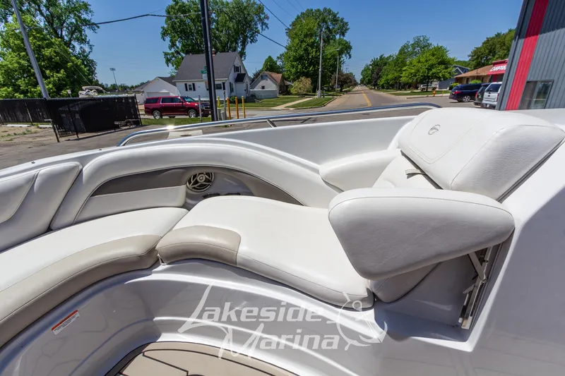Slide: The Image of 2008 Crownline 240 LS boat interior with white seating, parked near Lakeside Marina. - 34