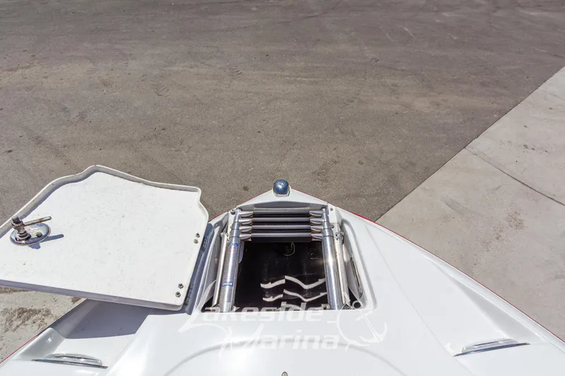 Slide: The Image of Bow view of 2008 Crownline 240 LS boat with open hatch and ladder. - 37