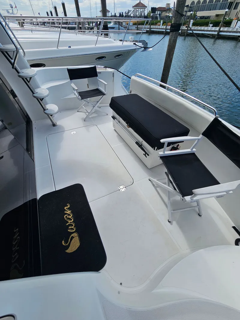 Slide: The Image of 1999 Carver 530 Voyager Pilothouse deck area at the marina. - 12