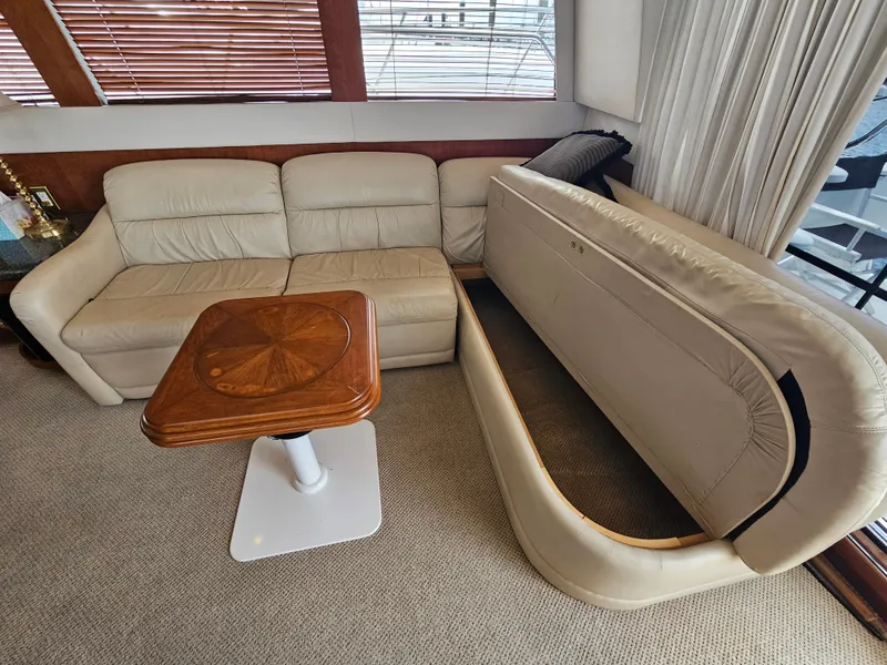 Slide: The Image of Interior of 1999 Carver 530 Voyager Pilothouse with sofa and table. - 18