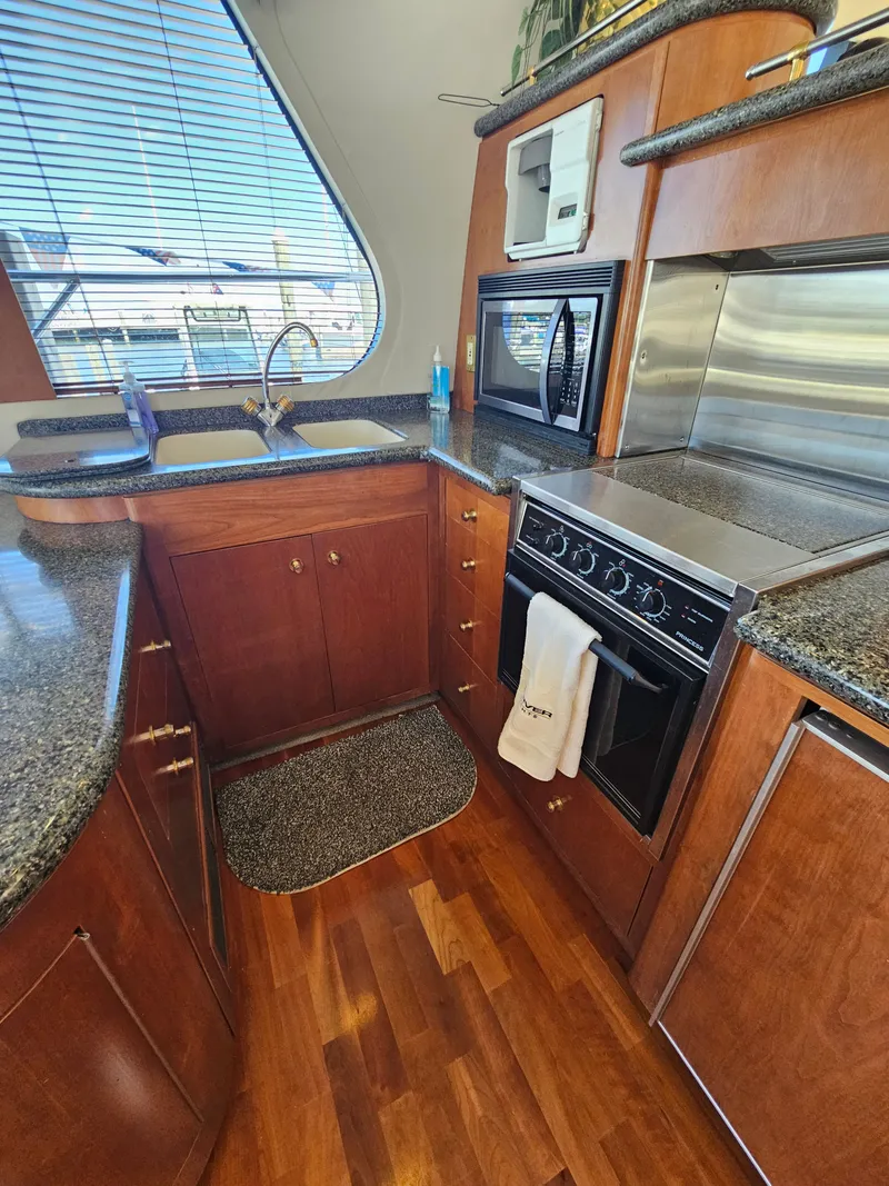 Slide: The Image of Interior of 1999 Carver 530 Voyager Pilothouse yacht kitchen. - 19
