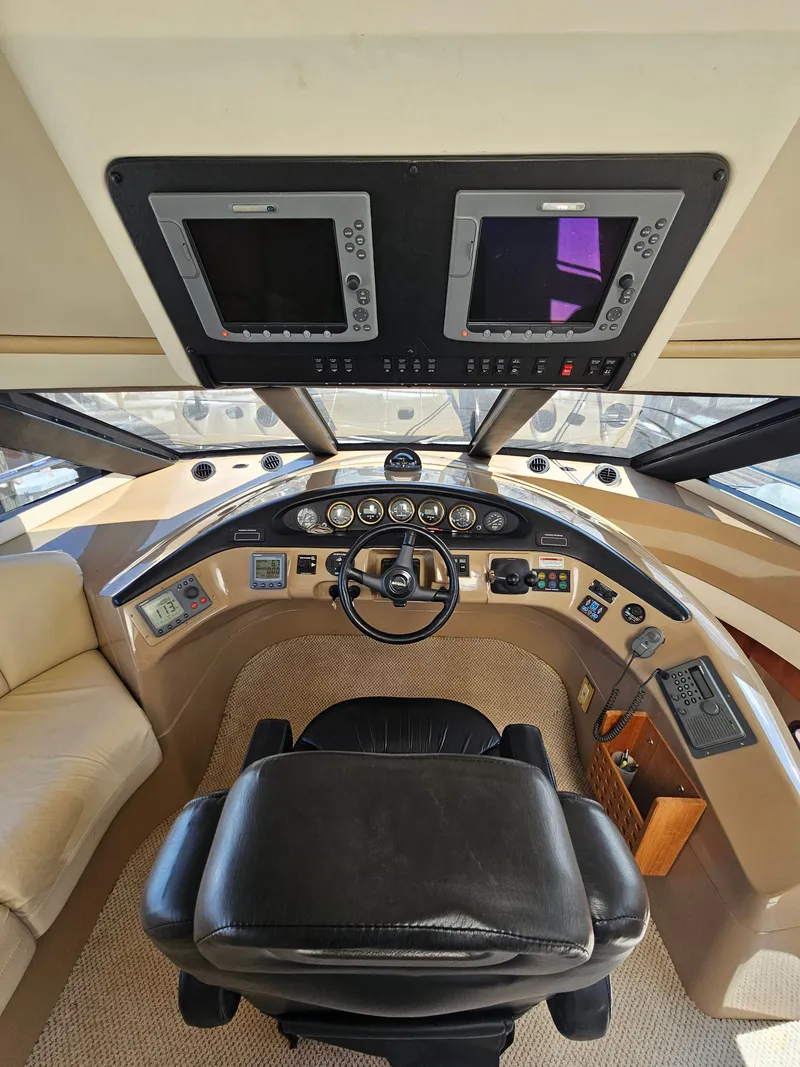 Slide: The Image of Interior view of a 1999 Carver 530 Voyager Pilothouse cockpit. - 2