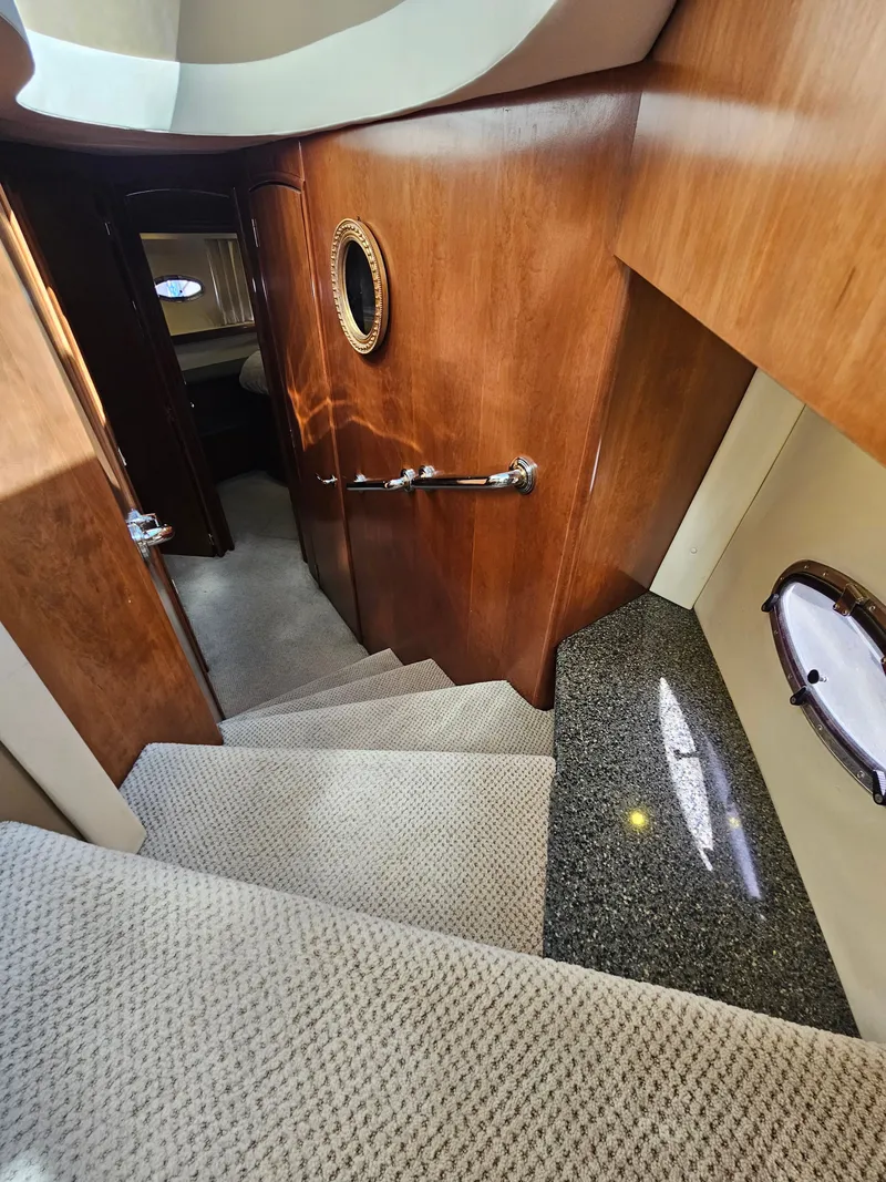 Slide: The Image of Interior of 1999 Carver 530 Voyager Pilothouse with stairs and wooden walls. - 24