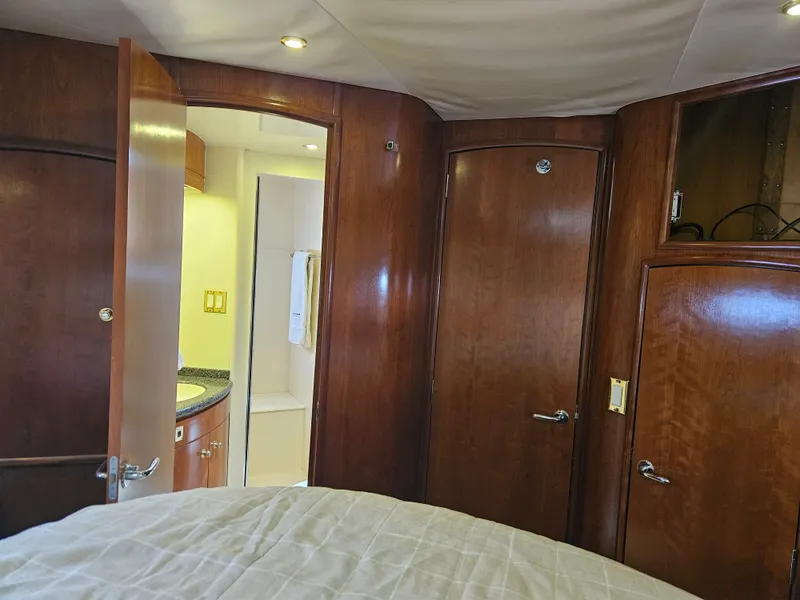 Slide: The Image of Interior of 1999 Carver 530 Voyager Pilothouse with wooden doors and bathroom. - 26