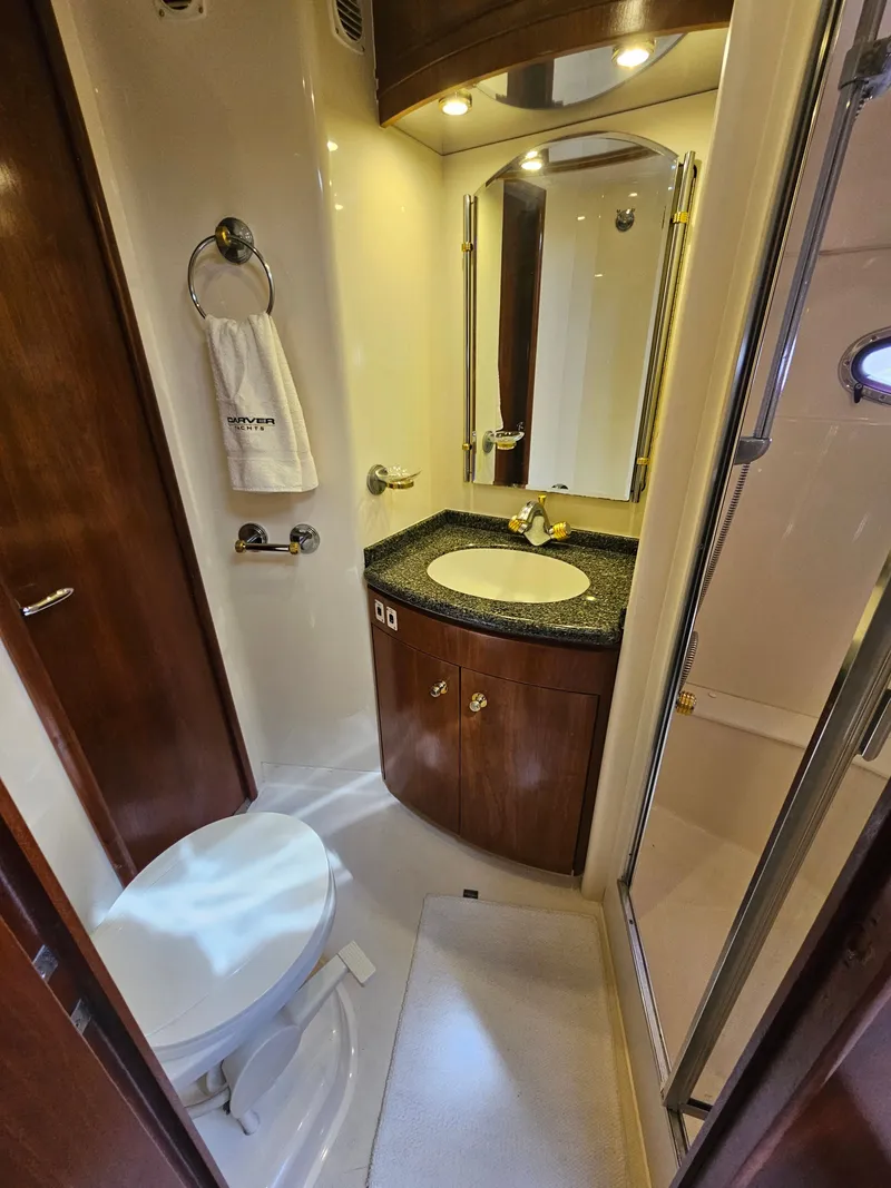 Slide: The Image of Luxurious bathroom in a 1999 Carver 530 Voyager Pilothouse yacht. - 29