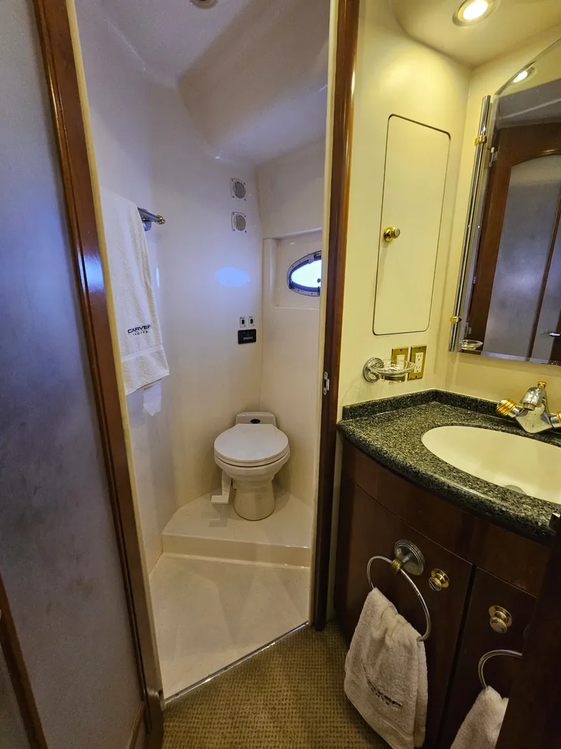 Slide: The Image of Bathroom in 1999 Carver 530 Voyager Pilothouse with toilet and sink. - 34