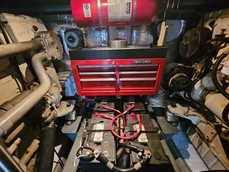 Slide: The Image of Engine room of 1999 Carver 530 Voyager Pilothouse with toolbox. - 41