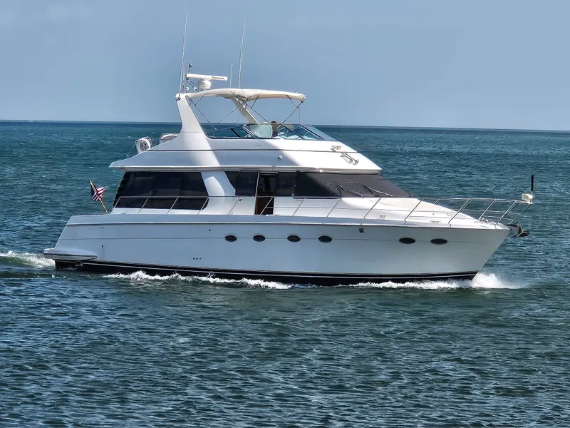 Slide: The Image of 1999 Carver 530 Voyager Pilothouse cruising on the sea. - 5