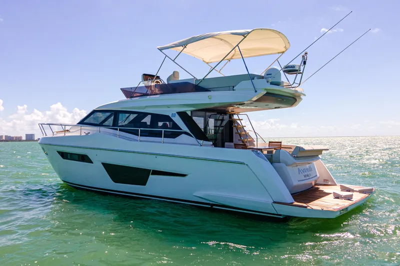 Slide: The Image of 2022 Ferretti Yachts 500 cruising on open water under clear skies. - 15