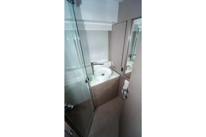 Slide: The Image of Modern bathroom interior on 2022 Ferretti Yachts 500, featuring sleek design and glass shower. - 32
