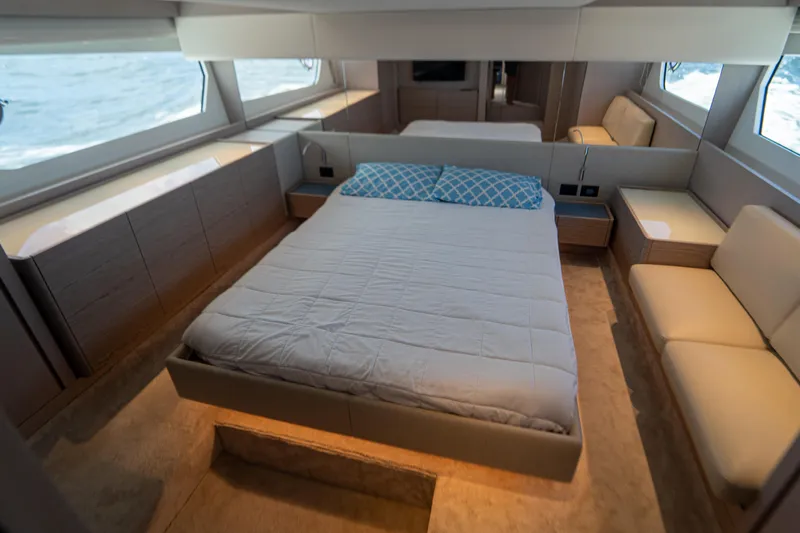 Slide: The Image of Luxurious bedroom interior of 2022 Ferretti Yachts 500 with modern design and large windows. - 33