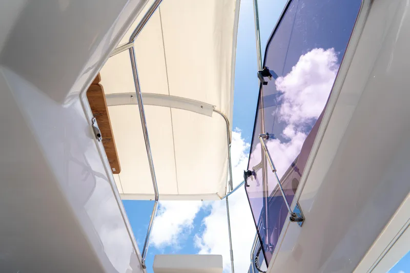 Slide: The Image of 2022 Ferretti Yachts 500, view of deck canopy and sky through glass. - 45