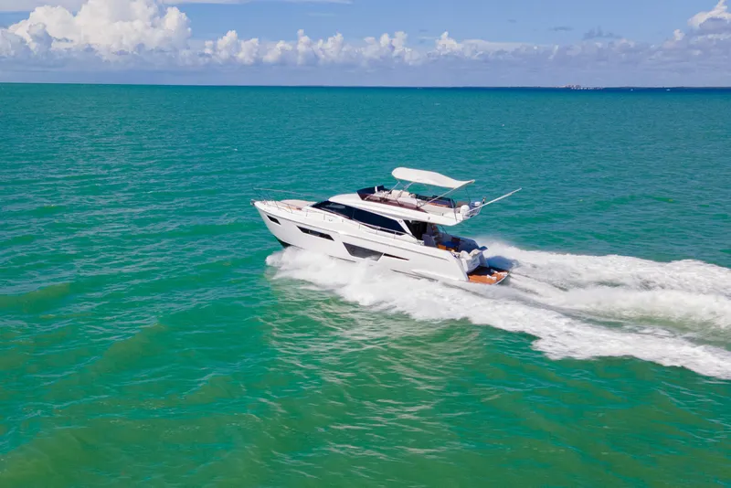 Slide: The Image of 2022 Ferretti Yachts 500 cruising on turquoise ocean under clear skies. - 5