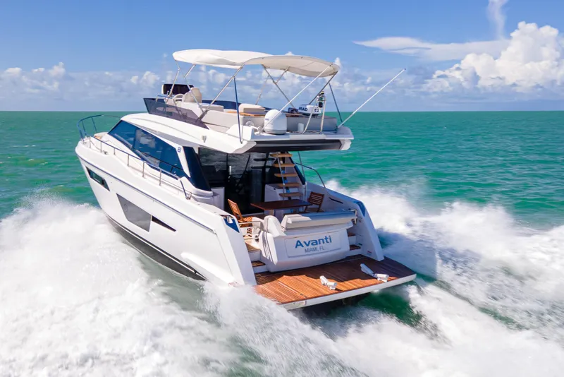 Slide: The Image of 2022 Ferretti Yachts 500 cruising on open sea under clear blue skies. - 6