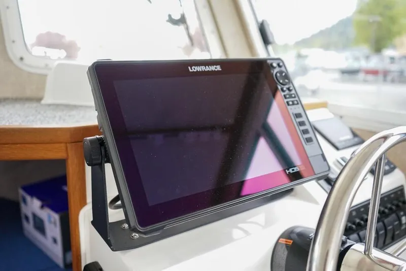 Slide: The Image of Lowrance HDS display on 2021 Sea Sport Explorer 2400 boat dashboard. - 13