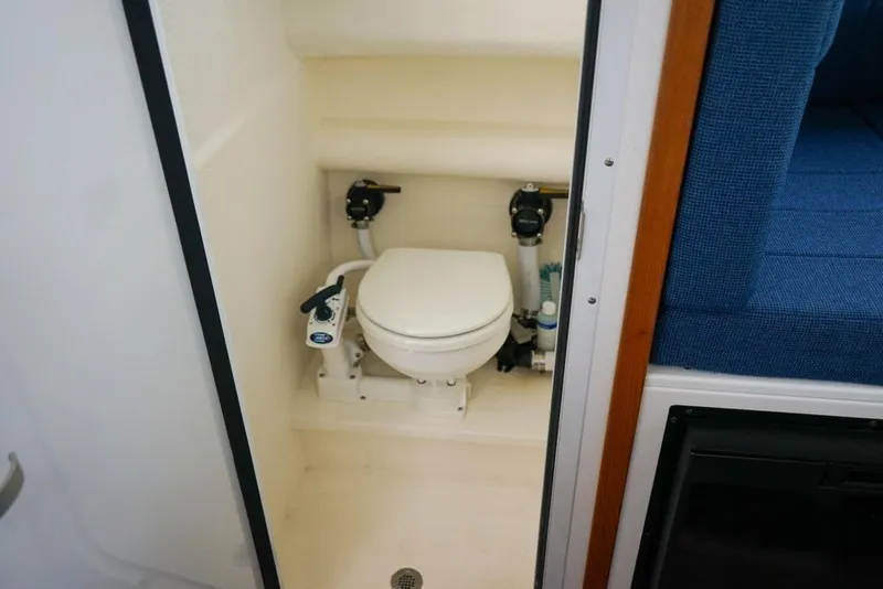 Slide: The Image of Compact marine toilet in 2021 Sea Sport Explorer 2400 boat interior. - 15