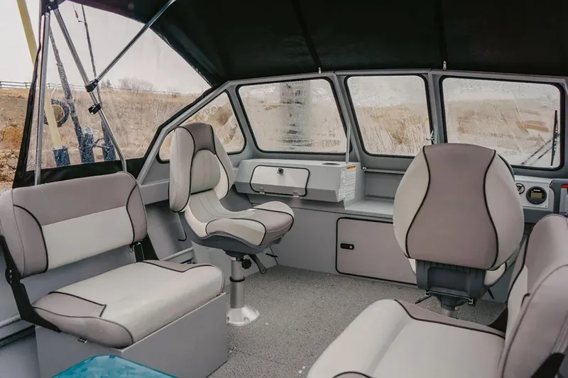 Slide: The Image of Manufacturer Provided Image: Interior of 2026 KingFisher 16 Falcon boat with modern seating and panoramic windows. - 4