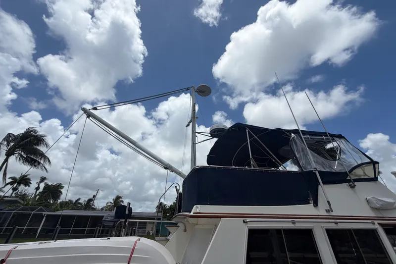 Slide: The Image of 1991 Grand Banks 46 Classic yacht under a partly cloudy sky. - 34