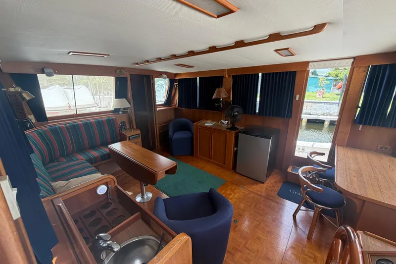 Slide: The Image of Interior of 1991 Grand Banks 46 Classic yacht with cozy seating and wooden furnishings. - 39