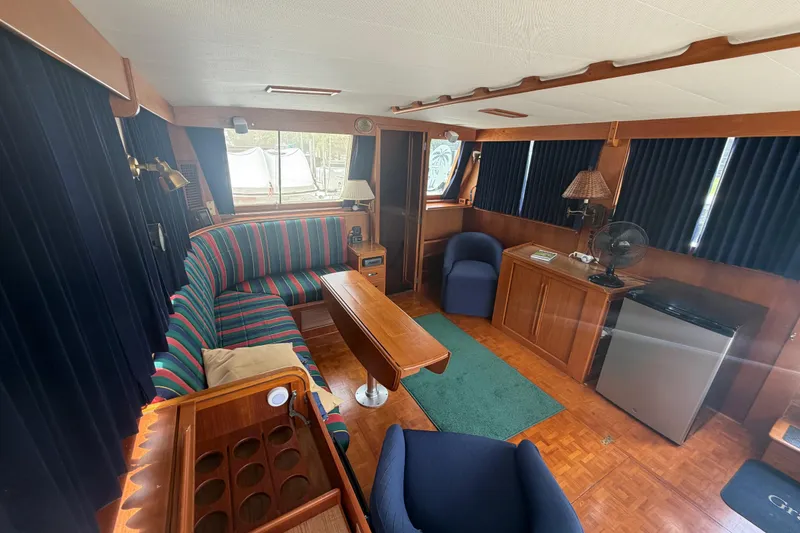 Slide: The Image of Interior of 1991 Grand Banks 46 Classic yacht with cozy seating and wooden furnishings. - 41