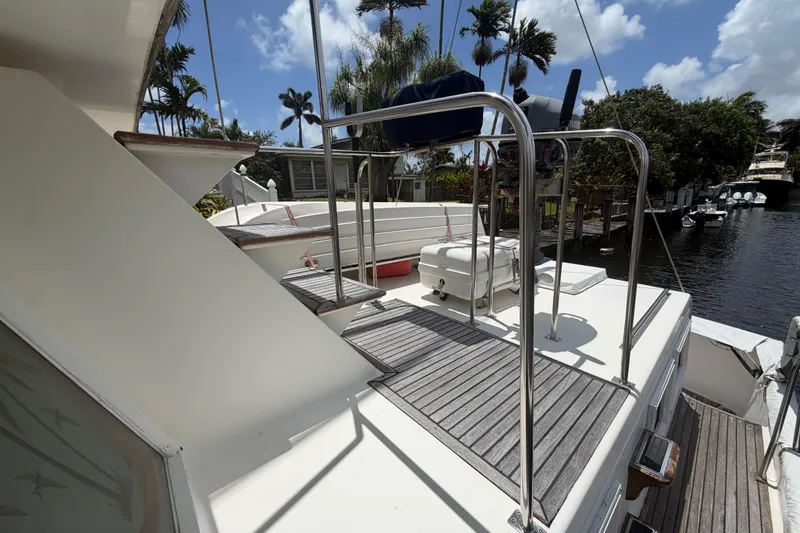 Slide: The Image of Deck view of 1991 Grand Banks 46 Classic yacht with stainless steel railings. - 9