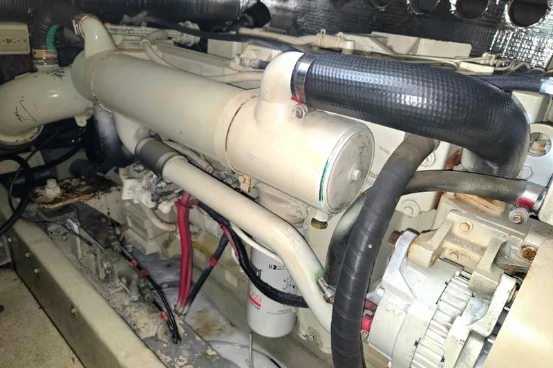 Slide: The Image of Engine compartment of a 2004 Carolina Classic 35 boat, showcasing detailed mechanical components. - 25