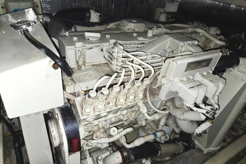 Slide: The Image of Engine compartment of a 2004 Carolina Classic 35 boat, showcasing intricate wiring and components. - 26
