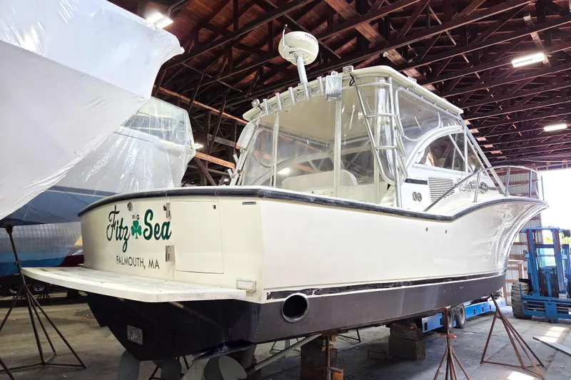Slide: The Image of 2004 Carolina Classic 35 boat in storage, Falmouth, MA, with protective covering. - 28