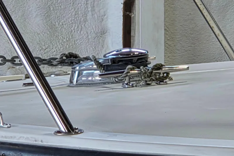 Slide: The Image of Close-up of a 2004 Carolina Classic 35 boat deck with anchor chain and cleat. - 4