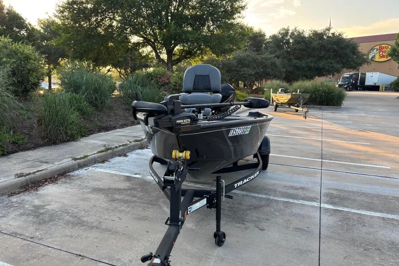 Slide: The Image of 2025 Tracker Super Guide V-16 T boat on trailer in parking lot. - 3