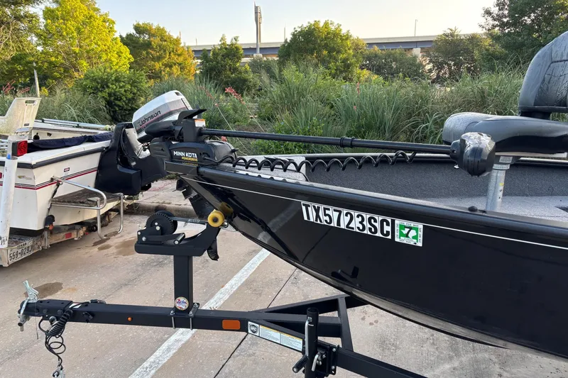 Slide: The Image of 2025 Tracker Super Guide V-16 T boat on trailer, featuring Minn Kota motor. - 4