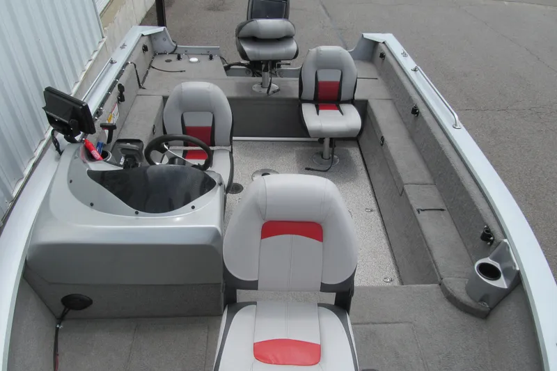 Slide: The Image of 2010 Tracker Pro Guide V-175 SC boat interior with seating and steering console. - 10