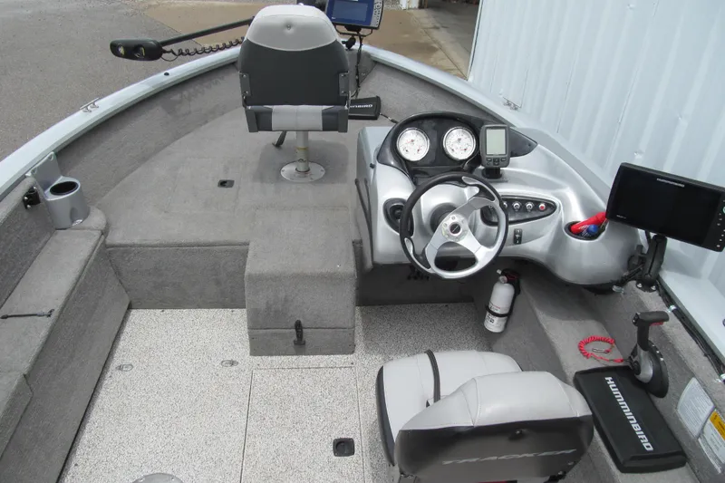 Slide: The Image of 2010 Tracker Pro Guide V-175 SC boat interior with steering console and seating. - 4