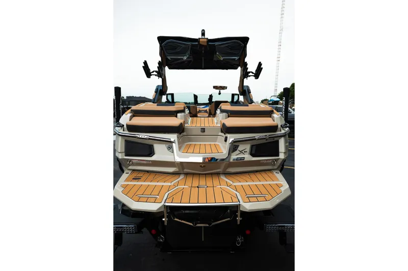 Slide: The Image of 2026 MasterCraft X24 boat with luxurious seating and sleek design, rear view. - 10