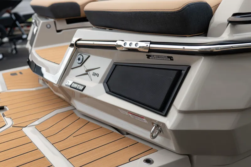 Slide: The Image of 2026 MasterCraft X24 boat rear view with teak deck and SurfStar feature. - 13