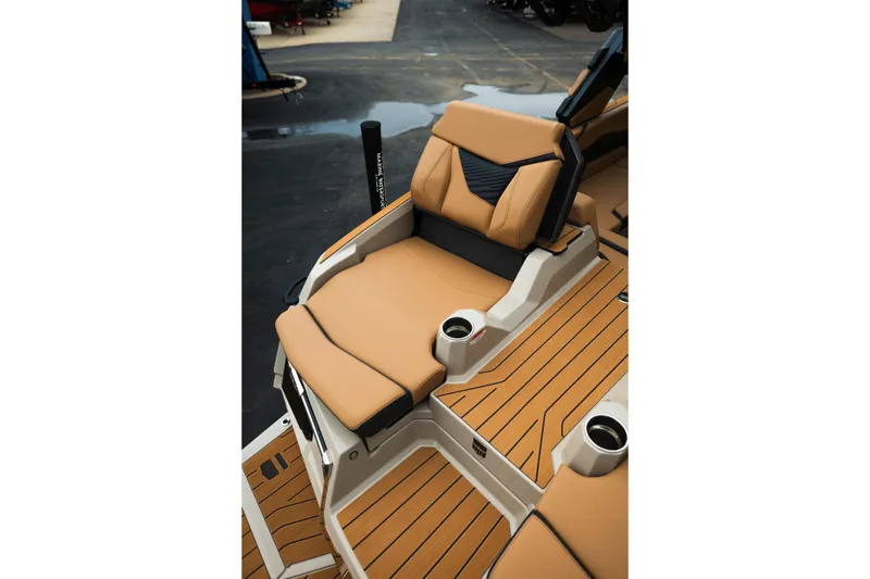 Slide: The Image of Luxurious seating on 2026 MasterCraft X24 boat with tan upholstery and cup holders. - 17