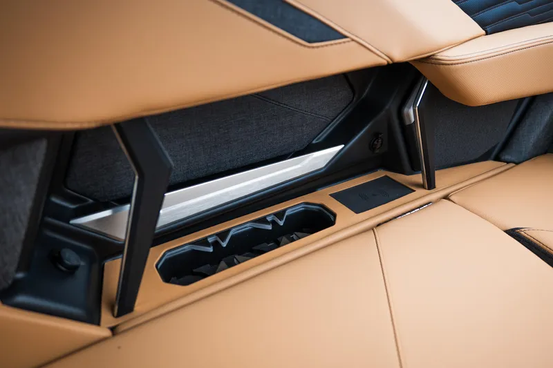 Slide: The Image of 2026 MasterCraft X24 interior detail with tan upholstery and integrated storage. - 19