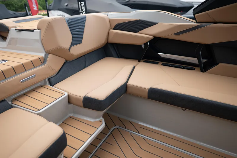 Slide: The Image of Luxurious interior of 2026 MasterCraft X24 boat with tan and black seating. - 21